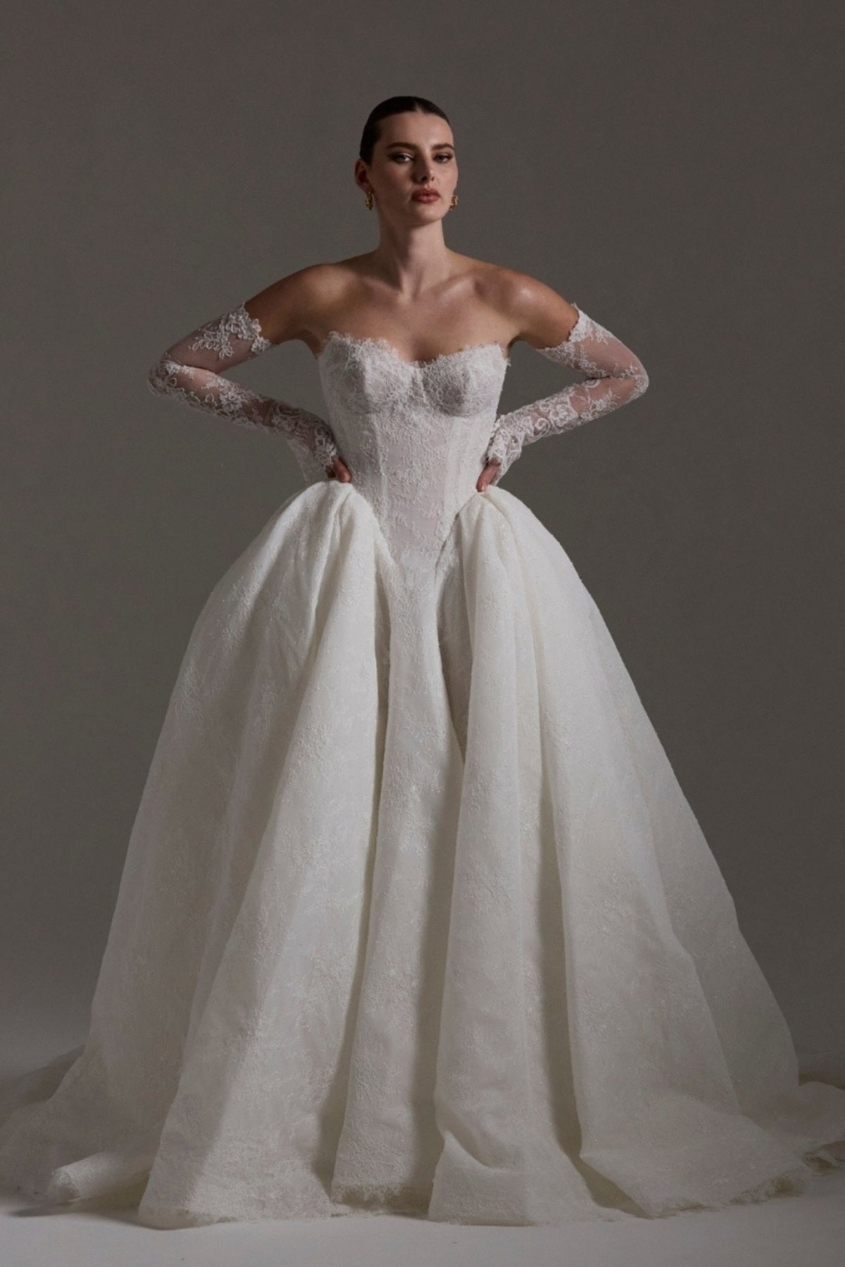 A line ballgown wedding dress with sweetheart neckline, and deep basque waistline in chantilly lace