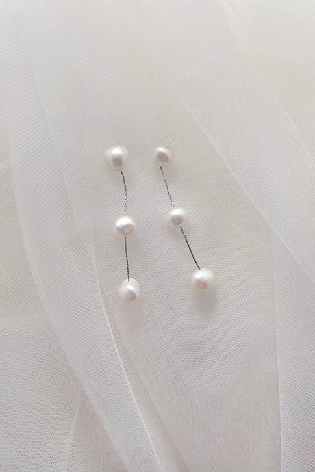 Image of Bella earrings with three freshwater pearls joined by silver chain