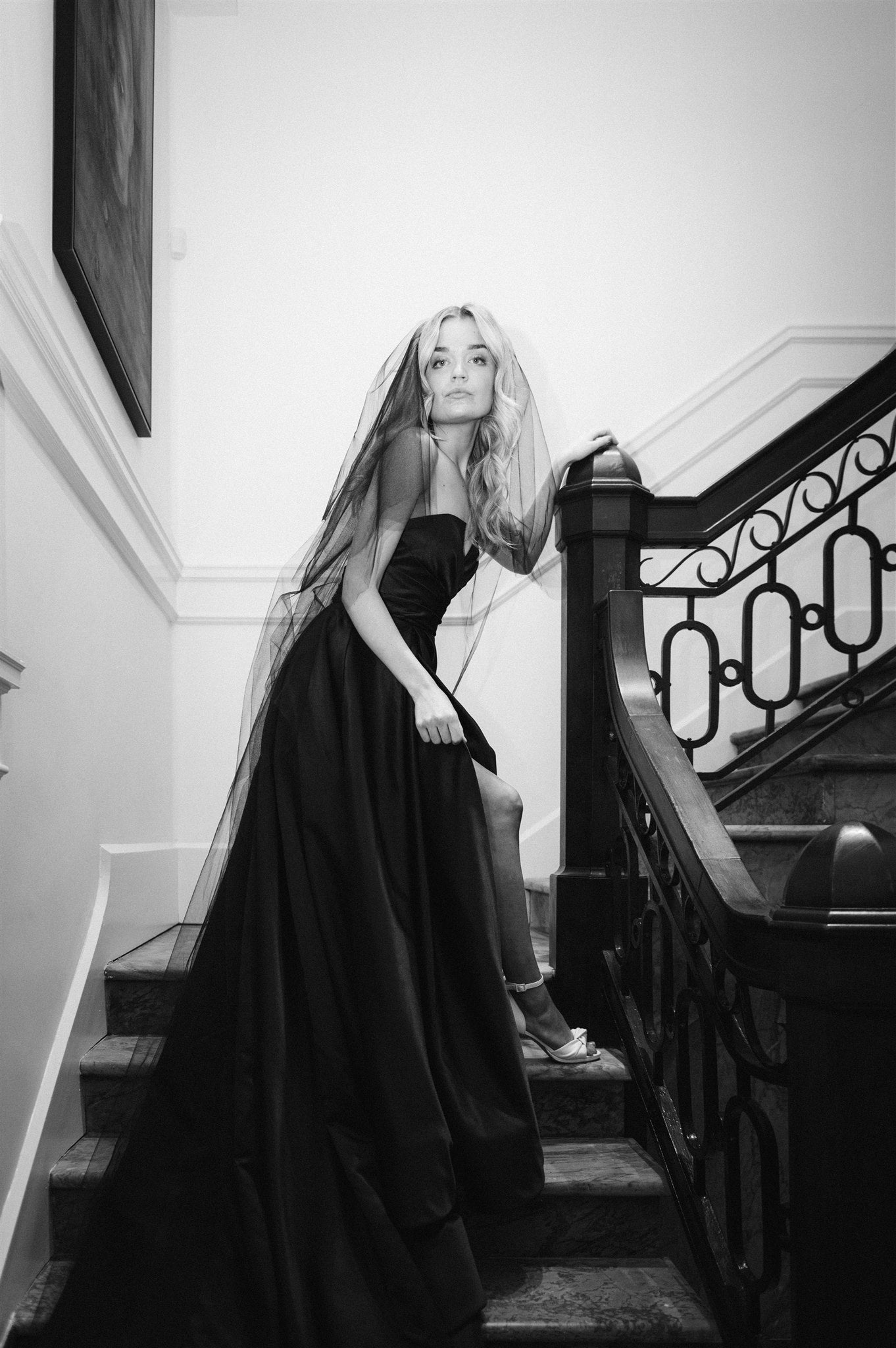 Model wears Daisha wedding gown in black with black veil