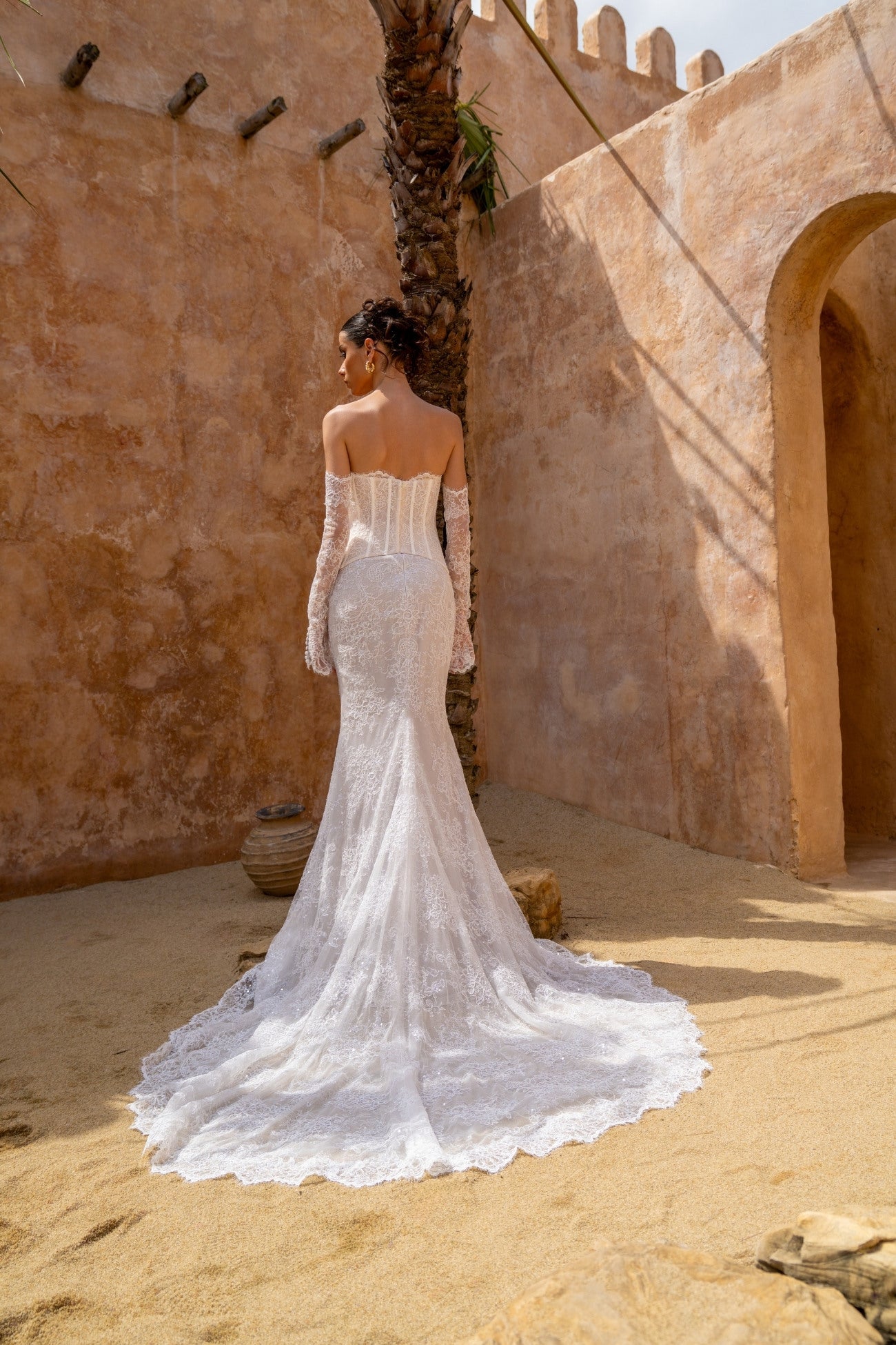 2-piece lace wedding gown, corset top and fitted skirt. paired with fitted sleeves 
