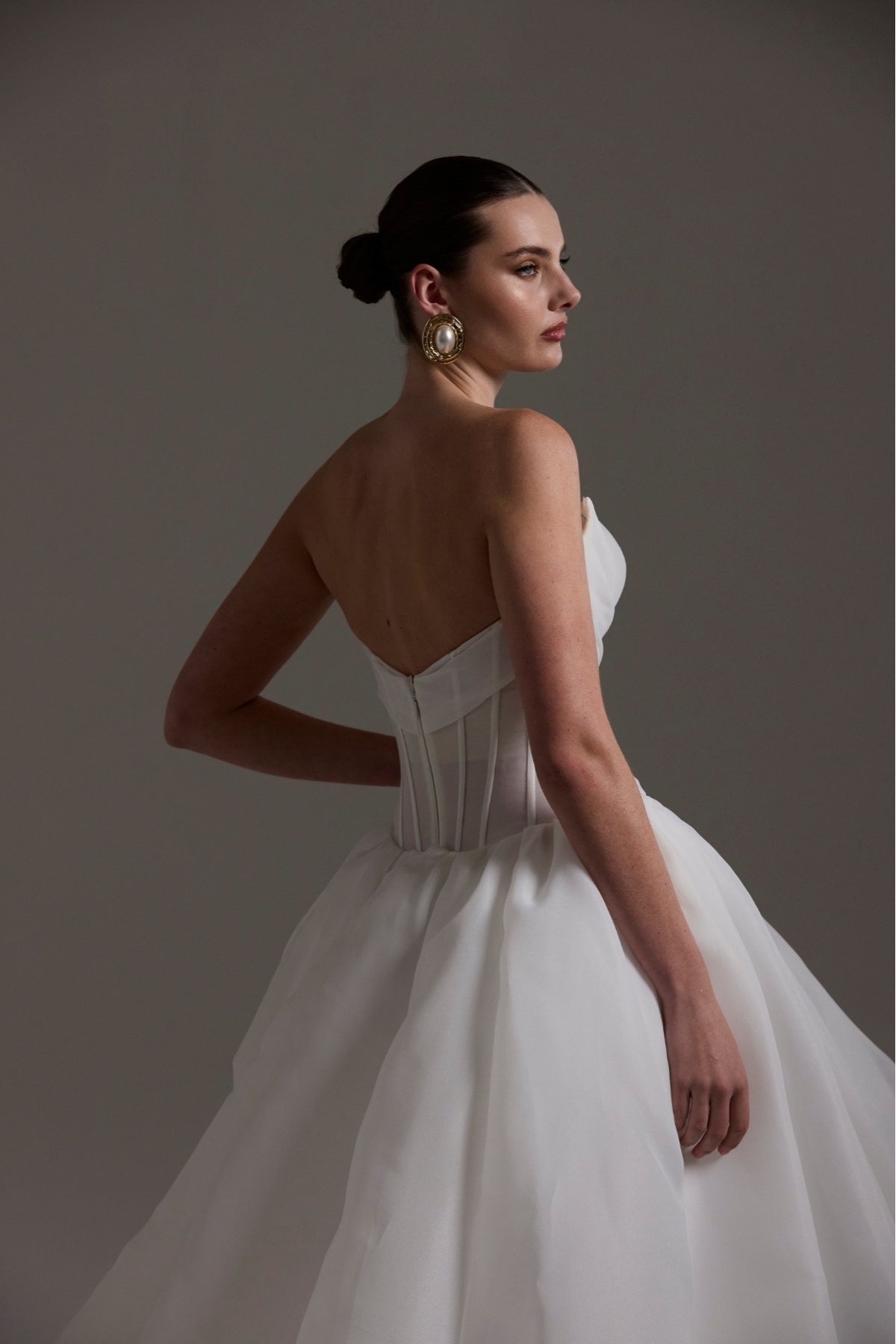 A-line wedding dress crafted in Organza, sweetheart neckline and asymmetrical ruffle down the skirt. 