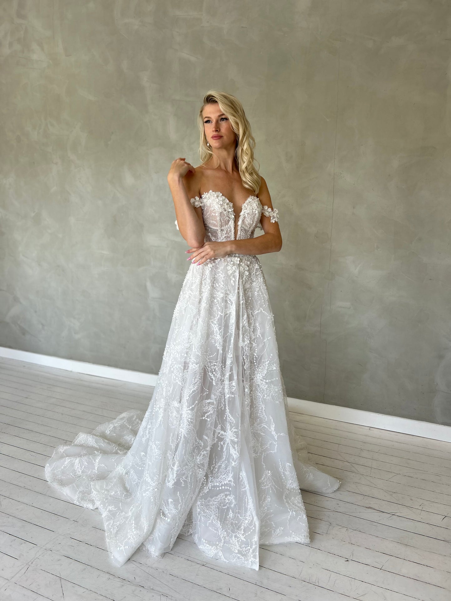 mini wedding dress, with off the shoulder straps and a V-plunge Sweetheart bodice. 