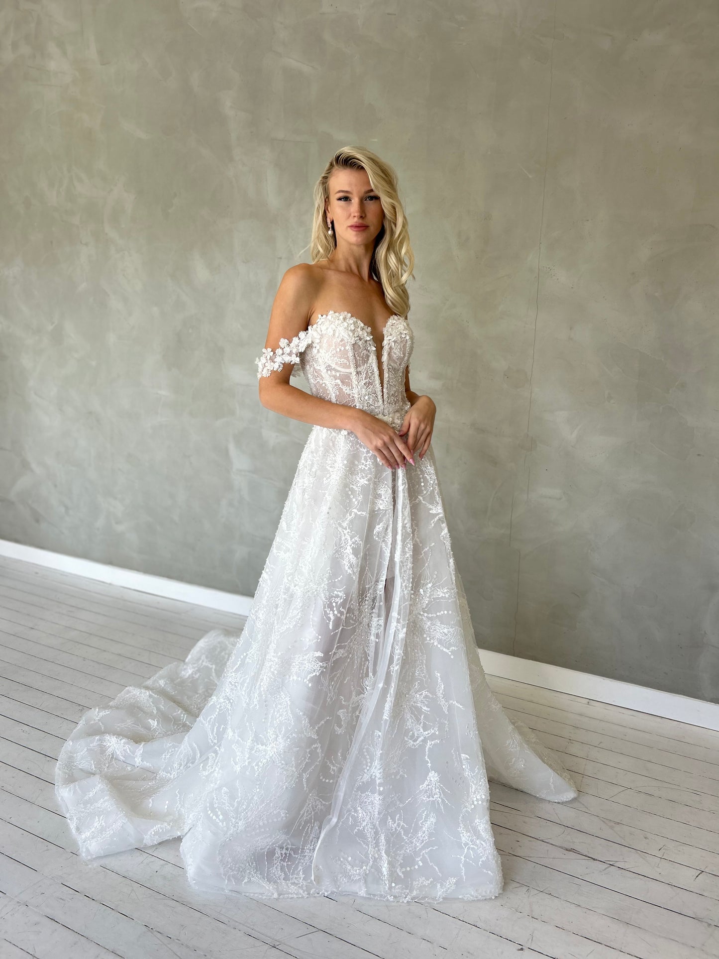 mini wedding dress, with off the shoulder straps and a V-plunge Sweetheart bodice. 