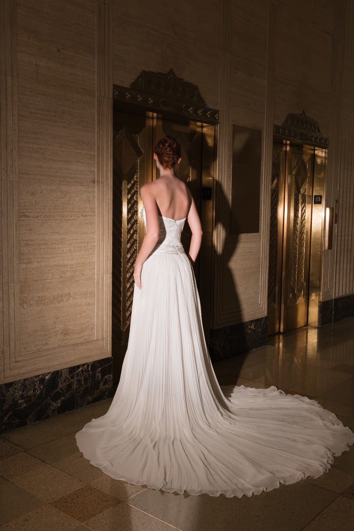 AURELLIA strapless beaded chain-draped satin and chiffon A-line wedding dress, full back view with sweeping train, by Atelier Wu
