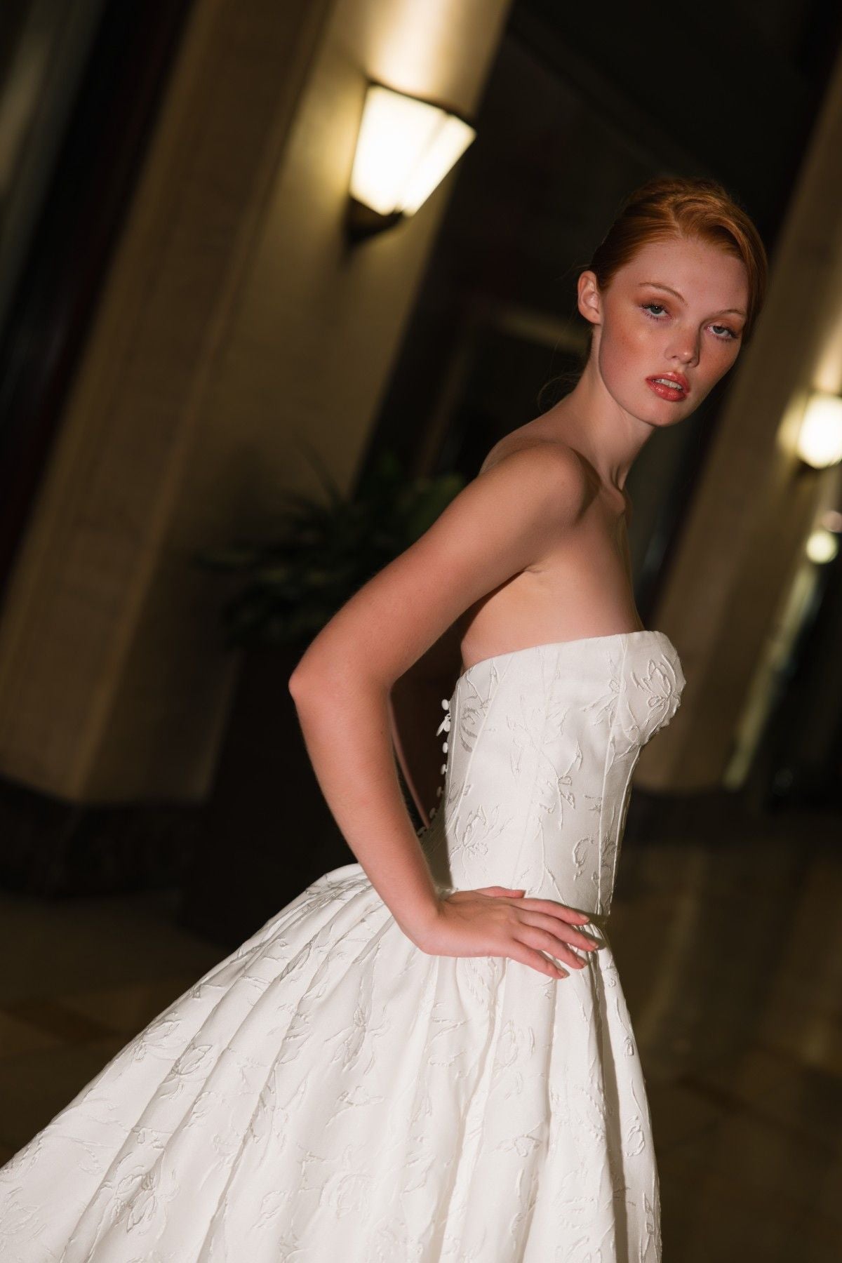 CHRISSY strapless sweetheart jacquard ballgown wedding dress, side profile showing back button detail, by Atelier Wu