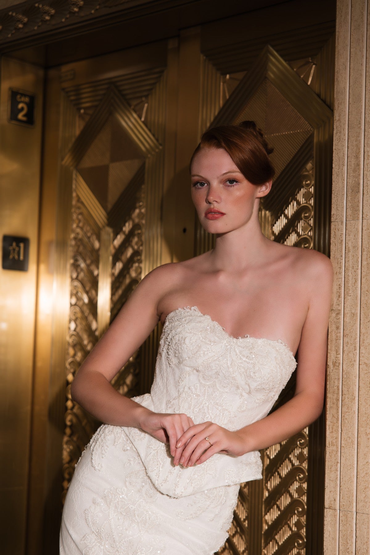 COSETTE strapless beaded lace mermaid wedding dress with peplum waist, close-up of the beaded lace bodice, by Atelier Wu