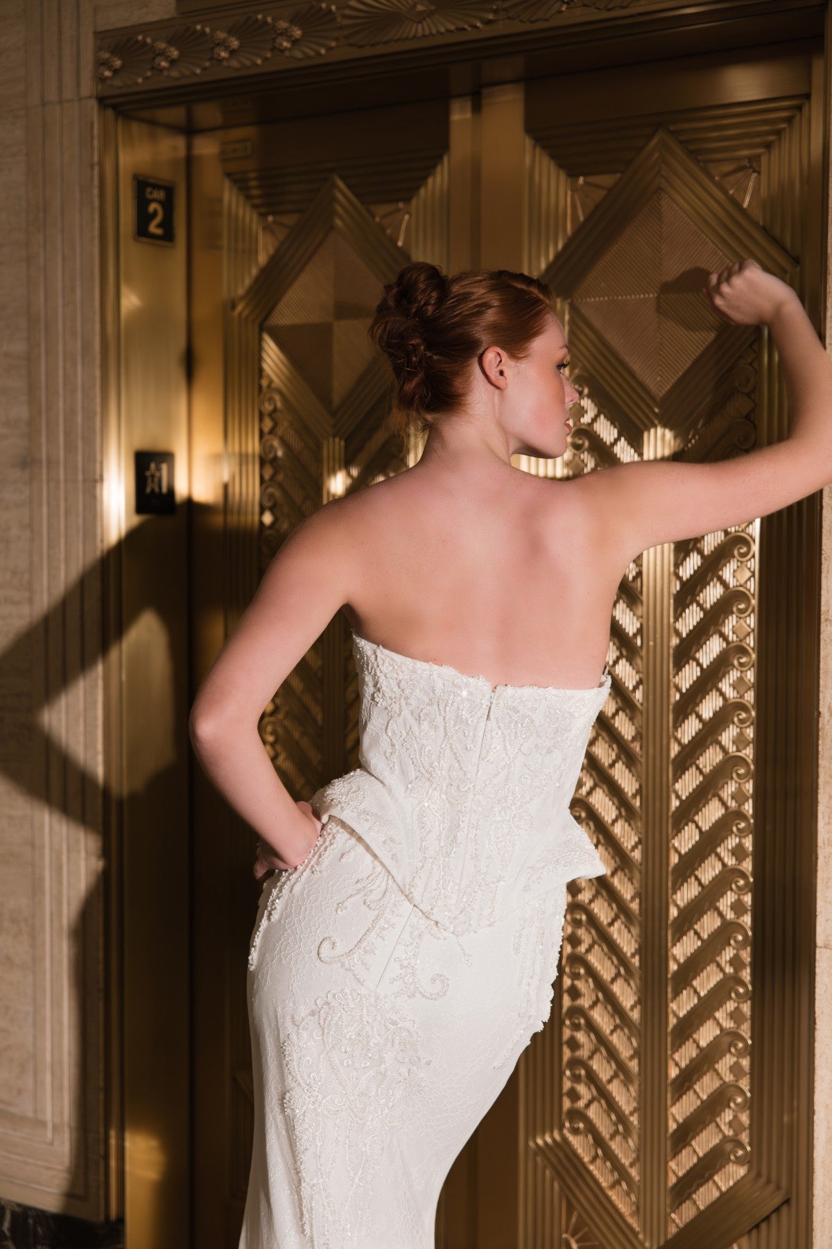 COSETTE strapless beaded lace mermaid wedding dress with peplum waist, back view of the peplum waist, by Atelier Wu