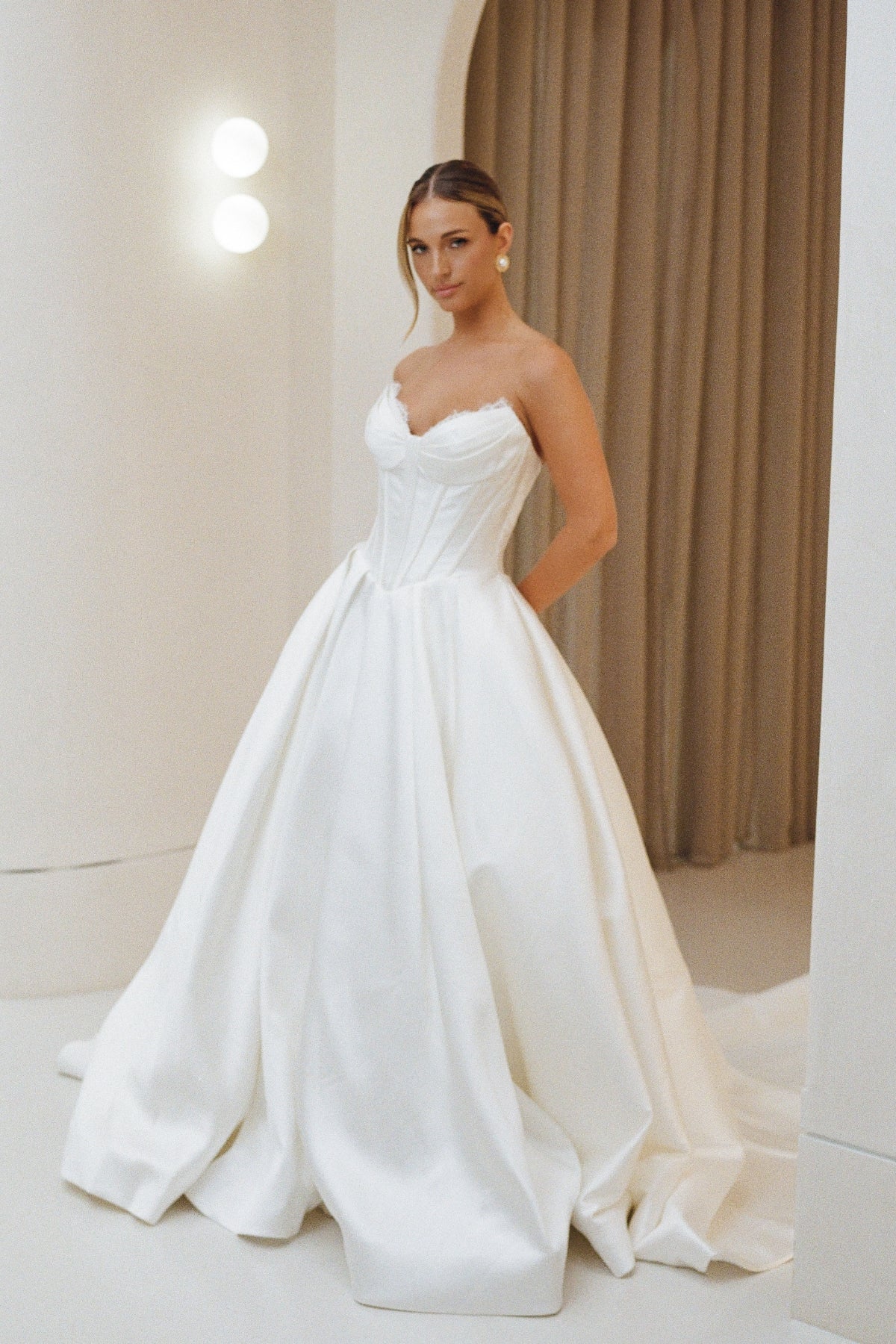 Mikado A-line dress, sweetheart neckline, basque waistline, voluminous skirt.