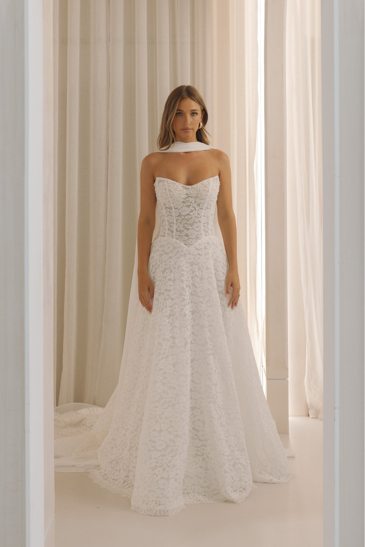 Lace A-line wedding gown with basque waist 