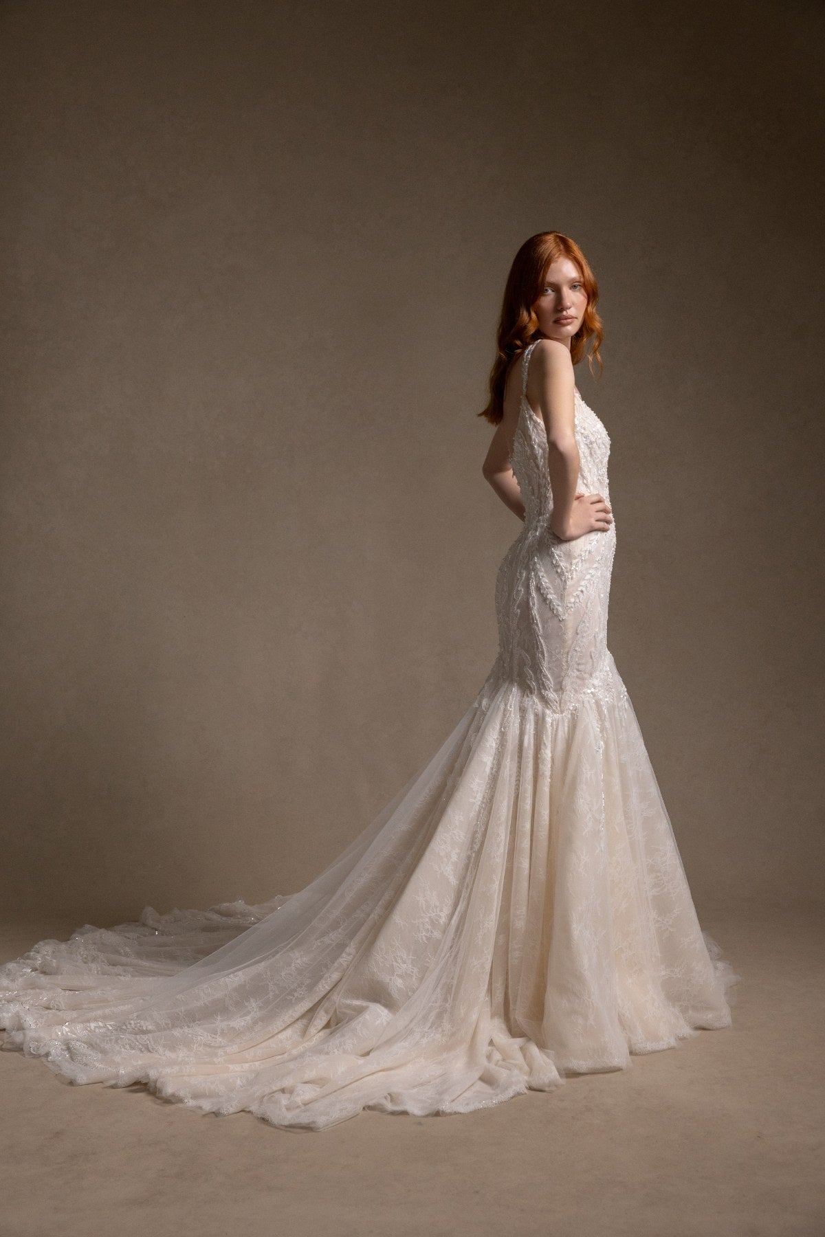 ILARIA square neckline beaded champagne mermaid wedding dress, back three-quarter view with long train, by Atelier Wu
