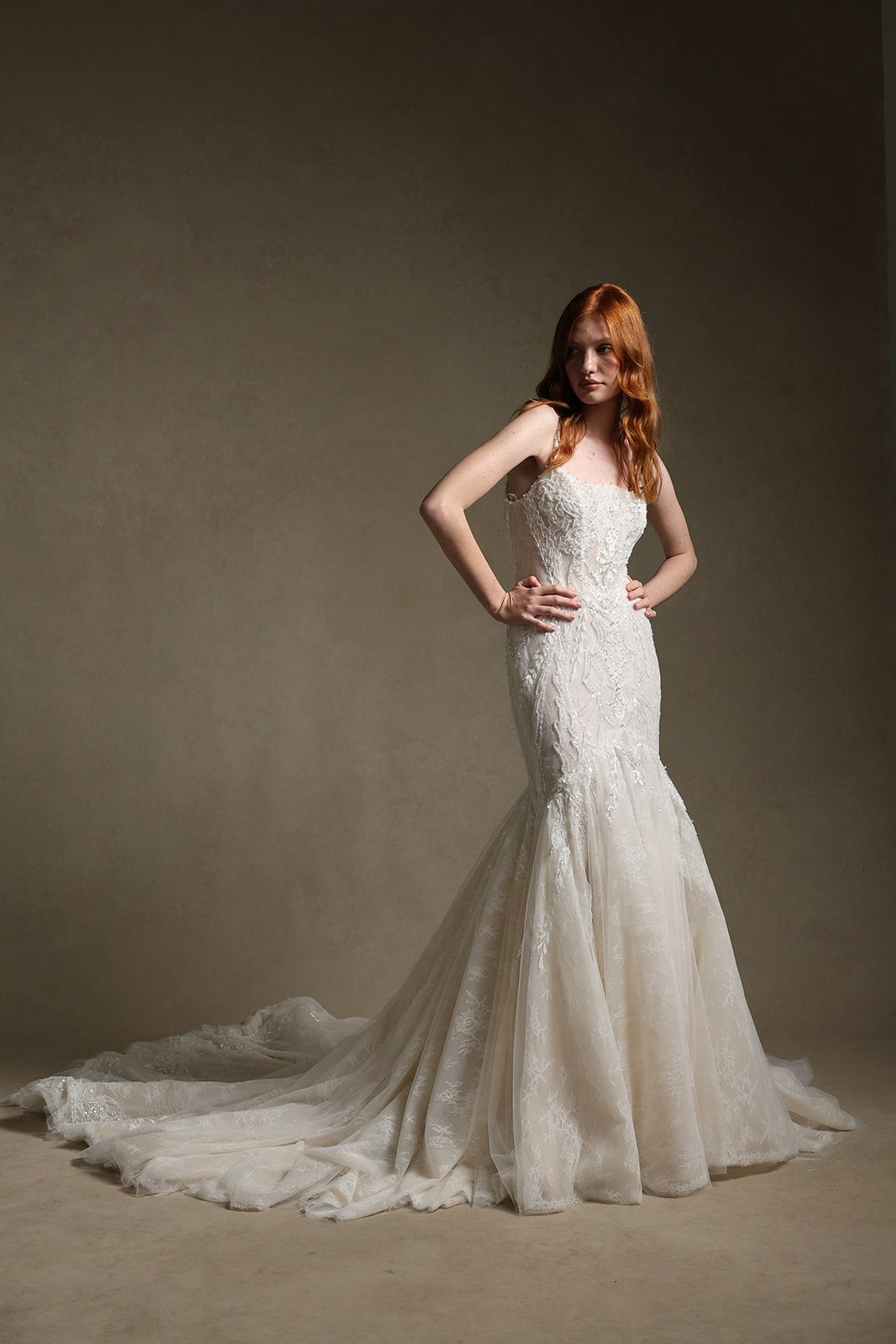 ILARIA square neckline beaded champagne mermaid wedding dress, front view, hands on waist, by Atelier Wu