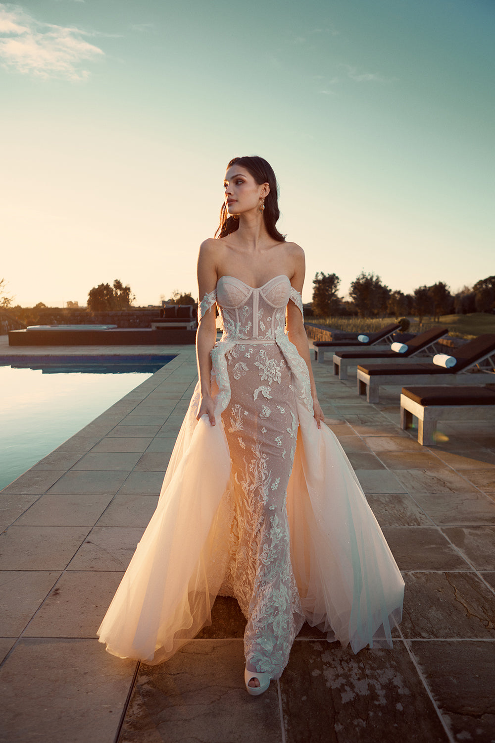 Model wears Jamina overskirt in soft tulle with lace detailing at the waist.