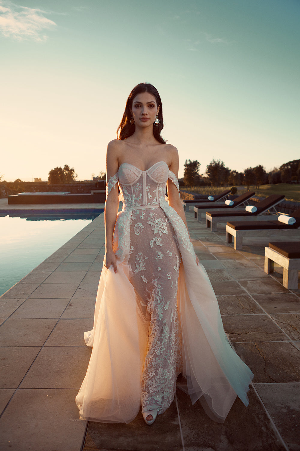 Model wears detachable Jamina overskirt made from soft tulle and adorned in lace applique at the waist.