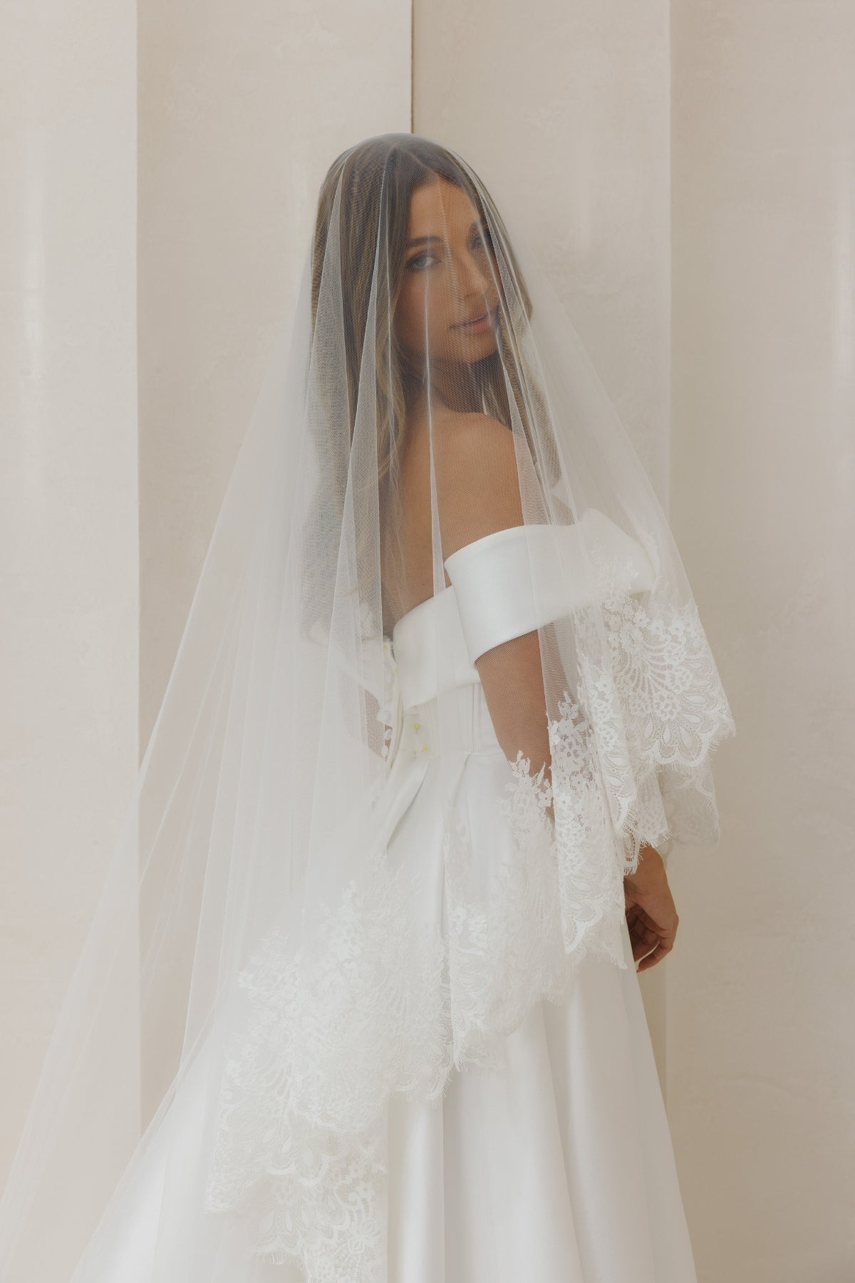A-line Mikado Wedding gown with off the shoulder neckline, Split on the left leg side and straight waist. 