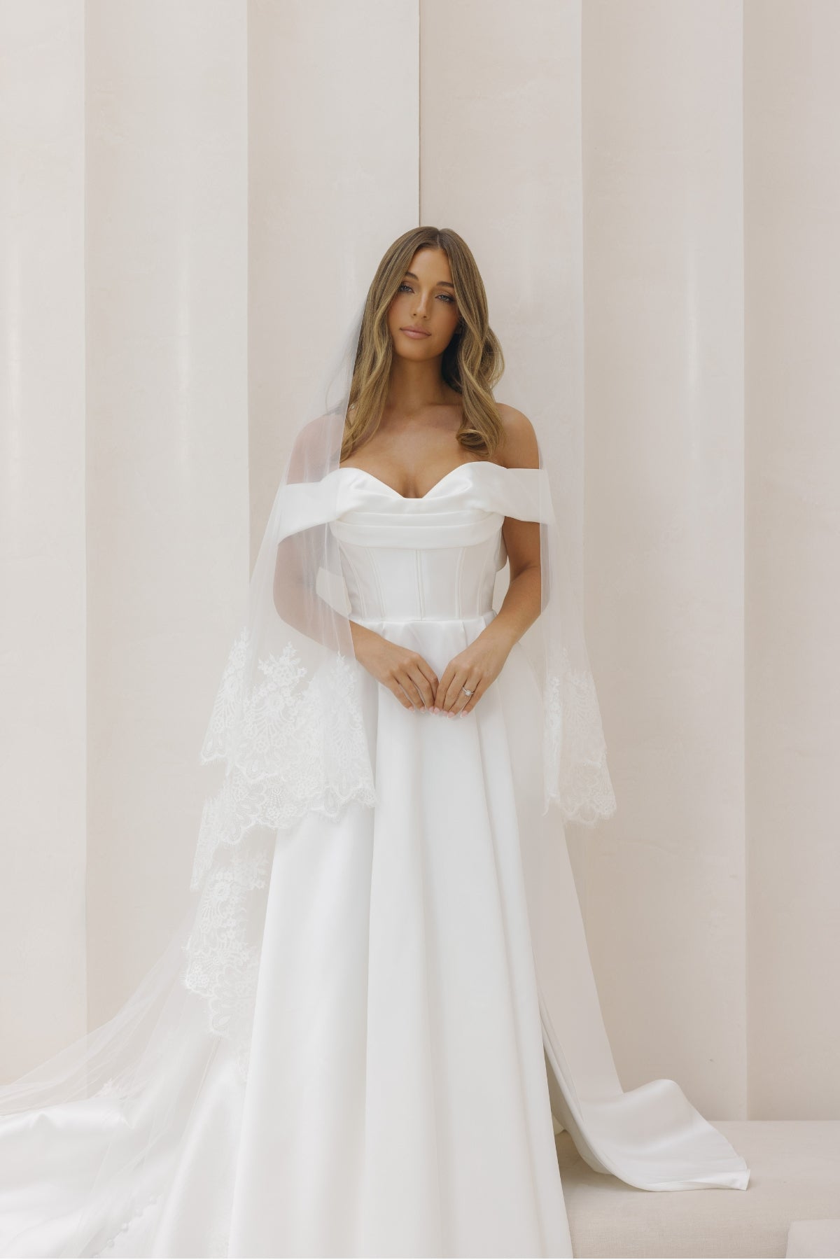 A-line Mikado Wedding gown with off the shoulder neckline, Split on the left leg side and straight waist. 