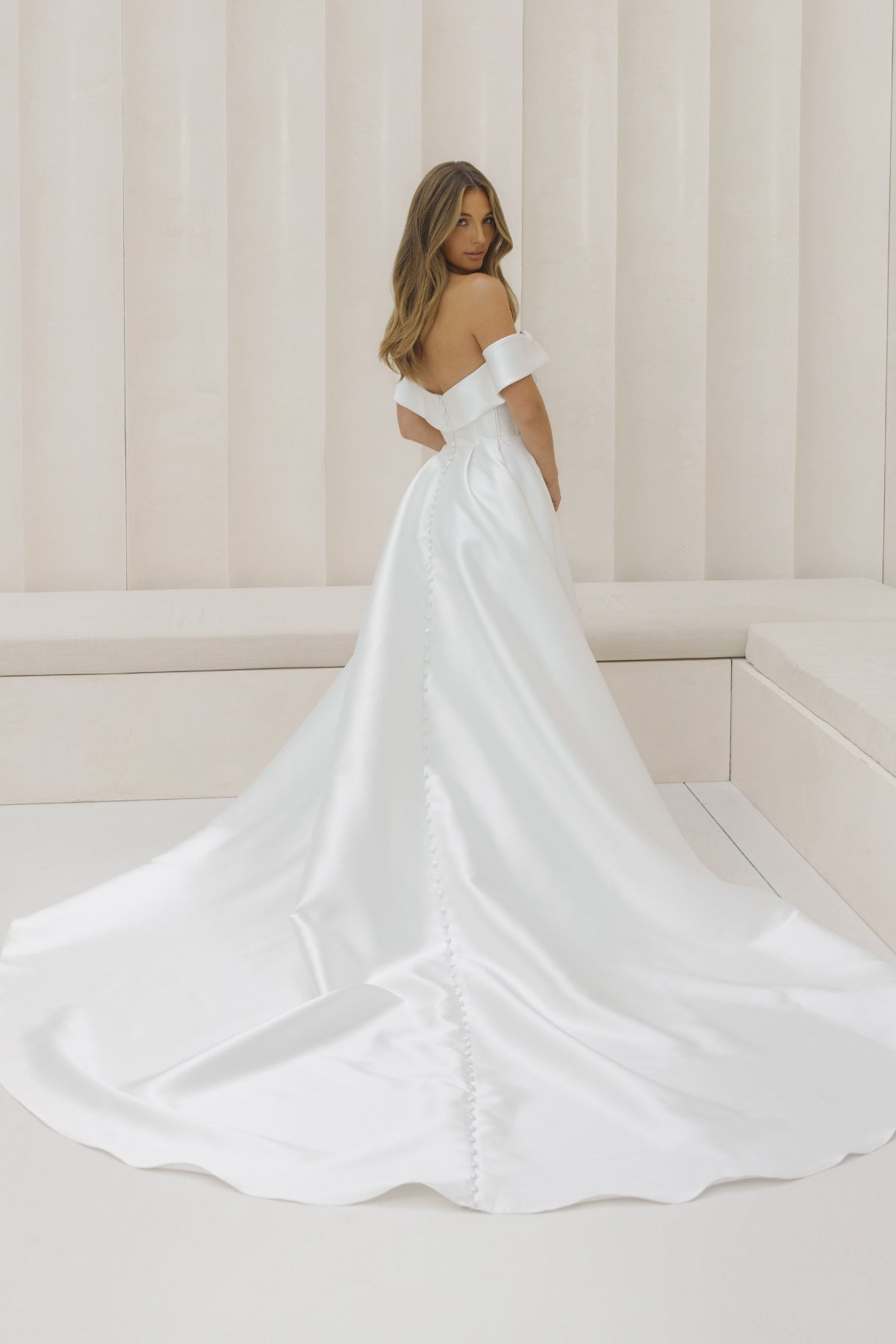 A-line Mikado Wedding gown with off the shoulder neckline, Split on the left leg side and straight waist. 