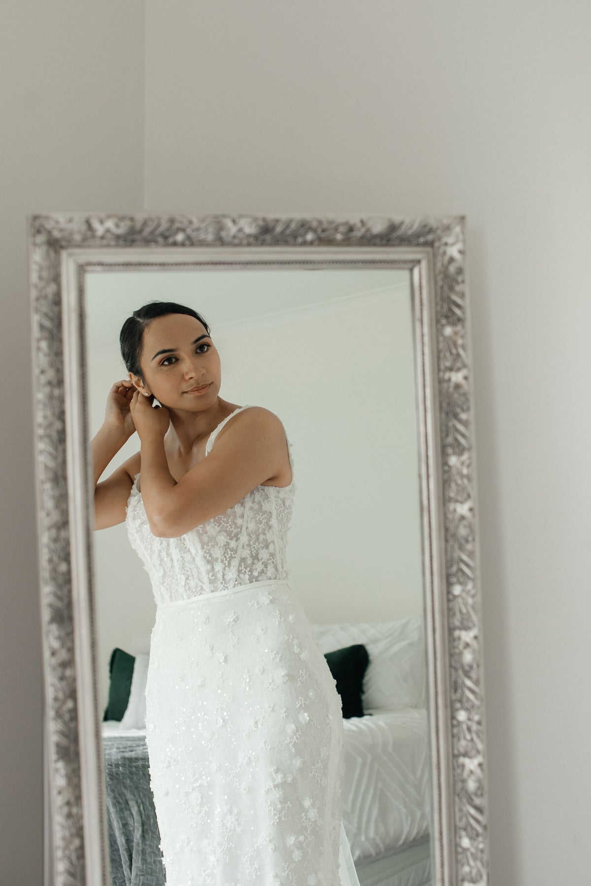 Ivory fit-n-flare wedding gown with delicate 3D florals and beads. Sheer boned corset with square neckline.