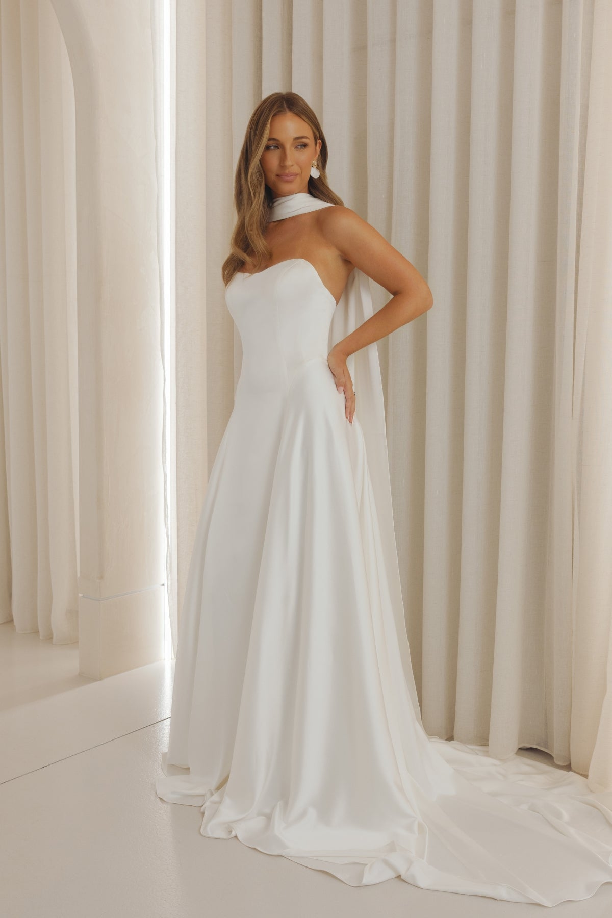 Satin wedding gown with sweetheart neckline, slim A-line sheath fit. 