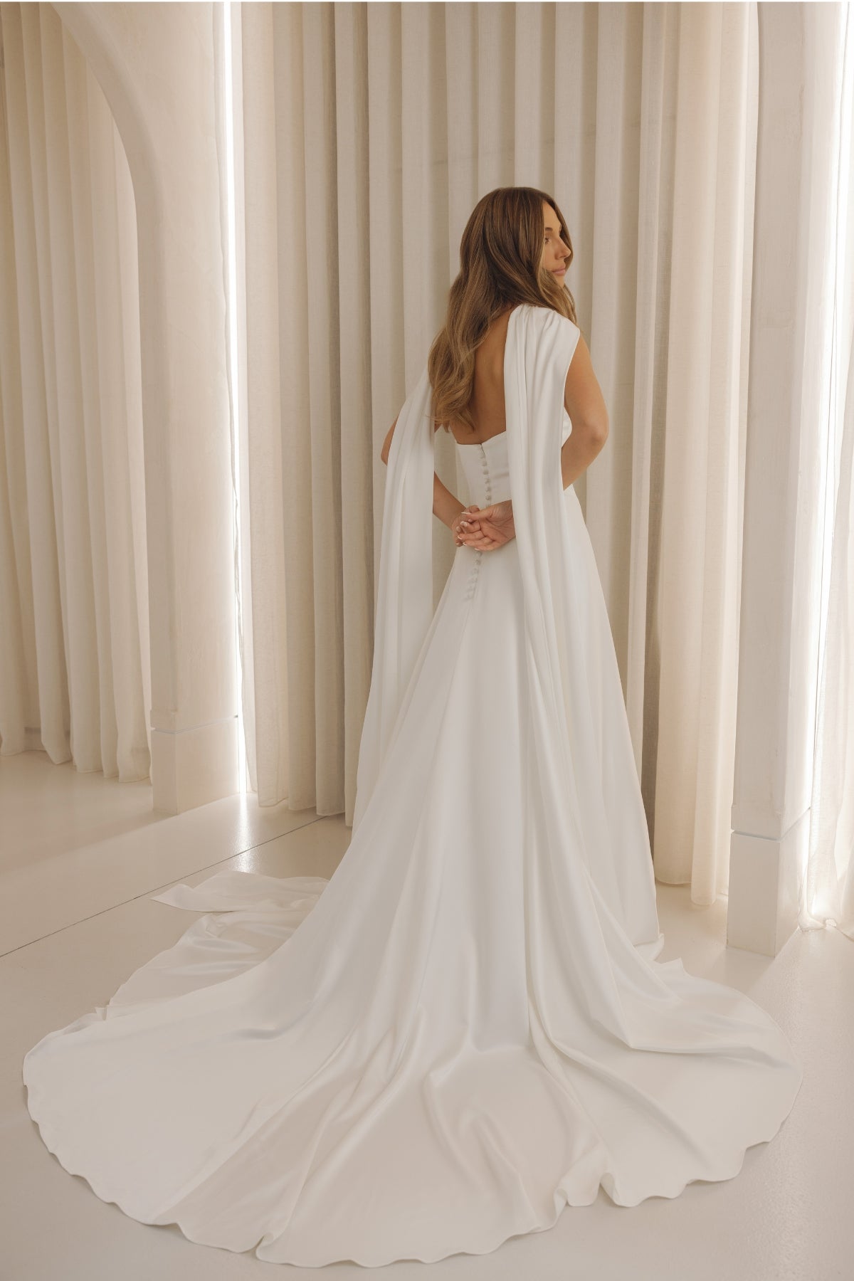 Satin wedding gown with sweetheart neckline, slim A-line sheath fit. 