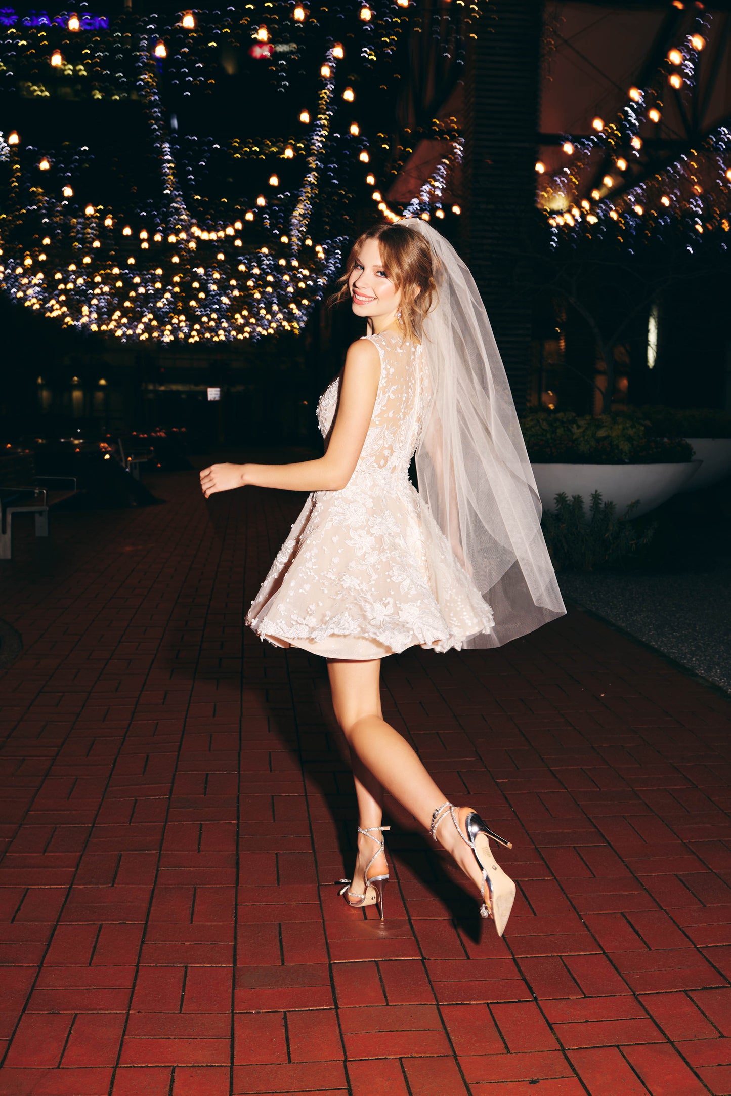 Mini Bridal dress featuring an llusion mesh V plunge neckline, A line skirt with floral lace. 