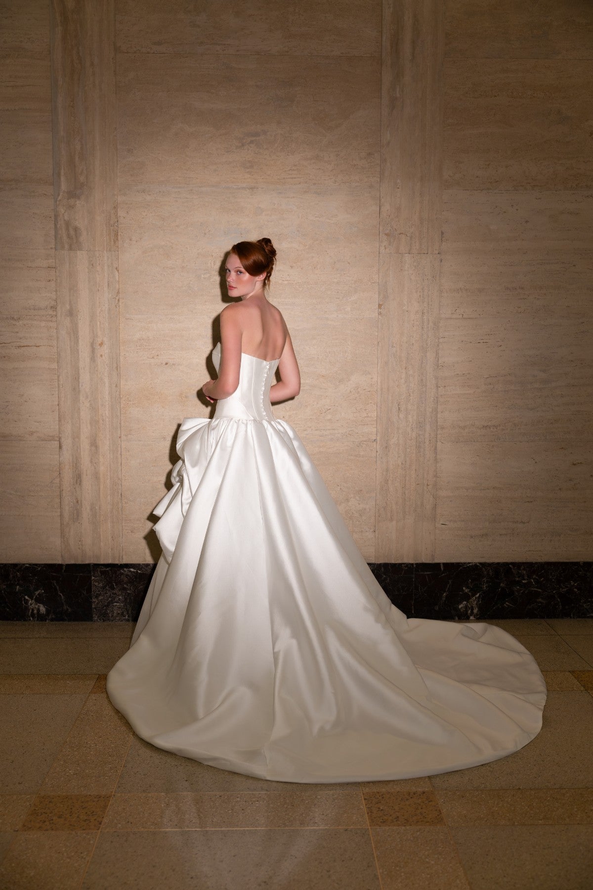 SIDONIE strapless sweetheart mikado ballgown wedding dress with draped pick-up skirt, full back view with sweeping train, by Atelier Wu