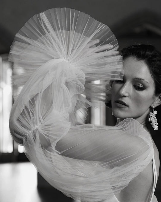 Soft plisse tulle detachable Savannah sleeves. Three tiered cinched with fine elastic and attached with transparent domes. 