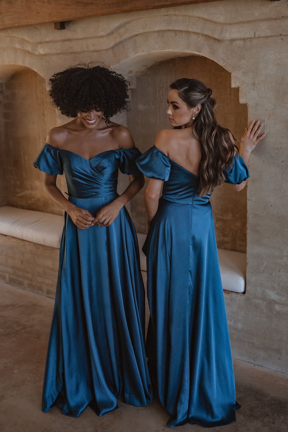 Full length satin bridesmaid dress in peacock blue. Front and back views with off-the-shoulder puffed sleeves