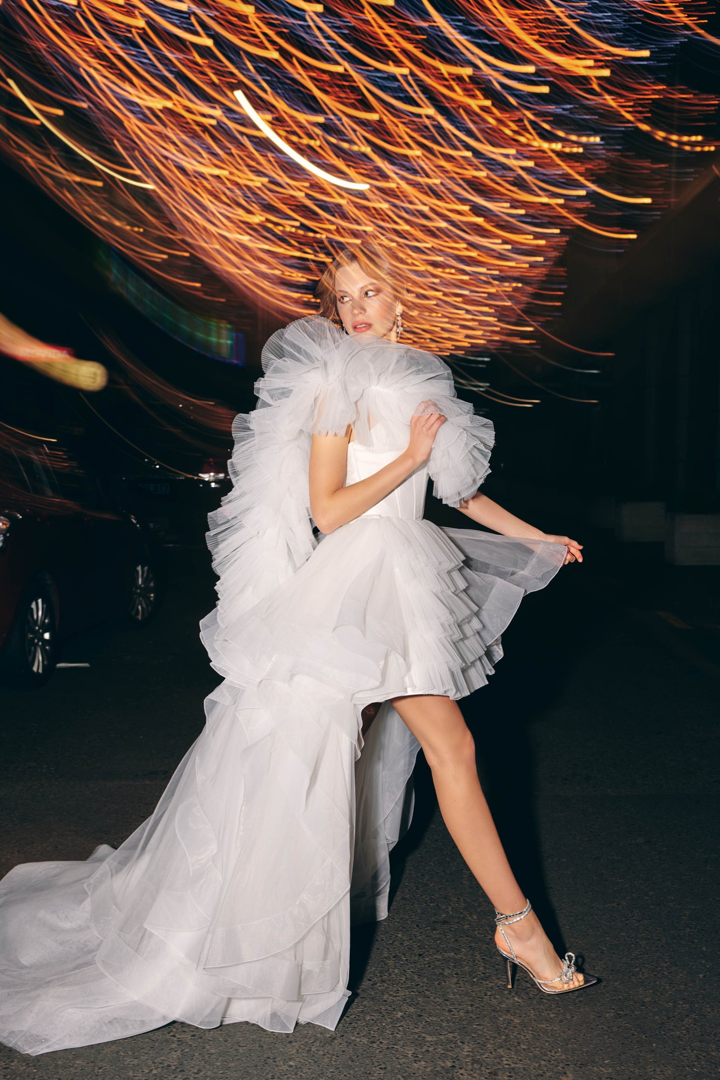 Mini Bridal dress featuring a ruffled tulle A line skirt and strapless corset bodice 