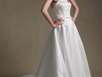 LIORA strapless satin A-line wedding dress with lace-trimmed neckline and sculpted waist bow by Atelier Wu