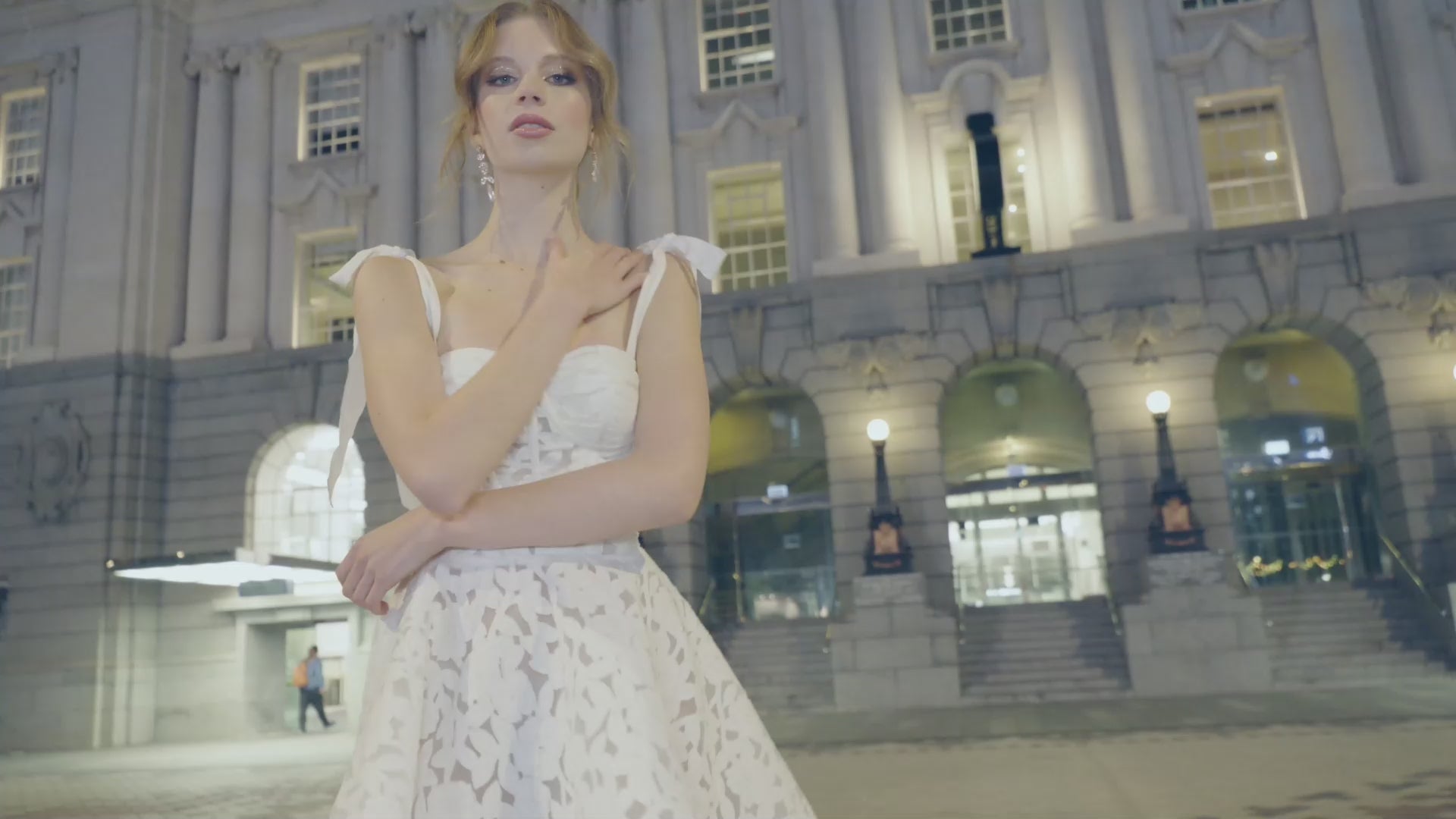 A-line mini Bridal dress with laser cut floral lace detailing featuring a
square neckline with ribbon straps 