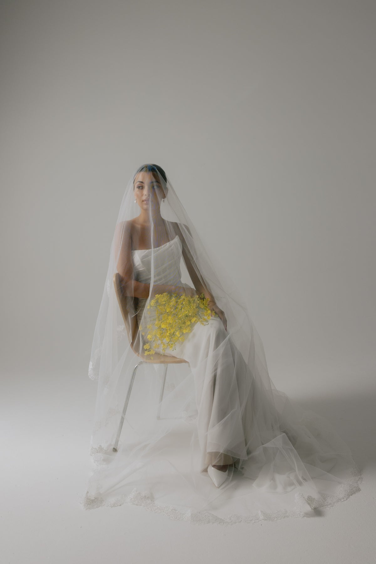 Corseted chiffon wedding gown, fitted lace-up back style. 