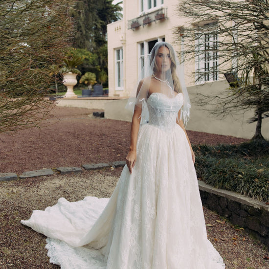 ELEANOR Bridal Gown - Wedding dress by Victoria Collection Jessica Couture. Featuring an A-line Princess ballgown with chapel train, and ruched corset Bodice with Chantilly lace. 