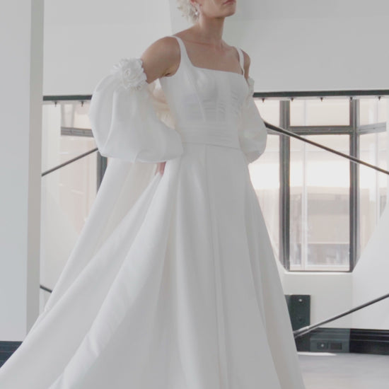 Fitted mini bridal dress with square neckline and boning