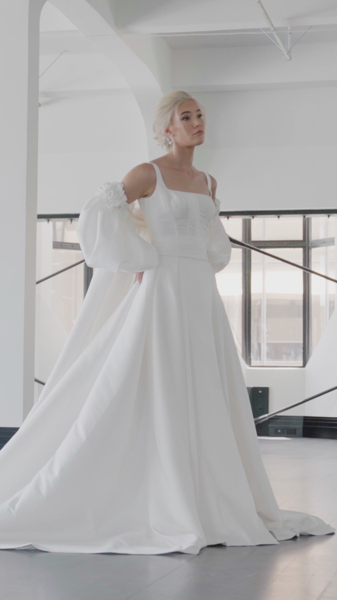 Fitted mini bridal dress with square neckline and boning