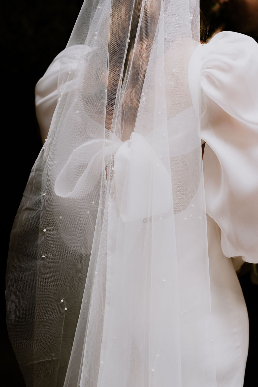 Bubble sleeve wedding dress with pearl tulle veil.