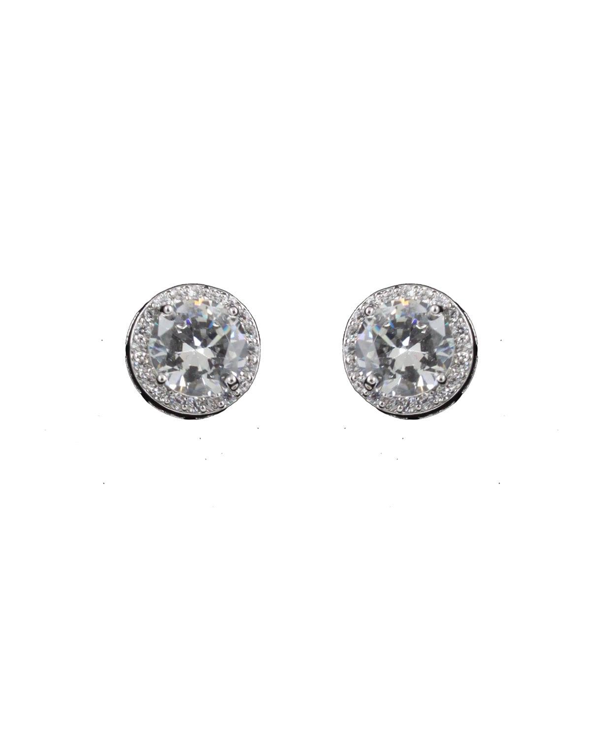 Round cubic zirconia in a border of smaller cubic zirconia set in silver