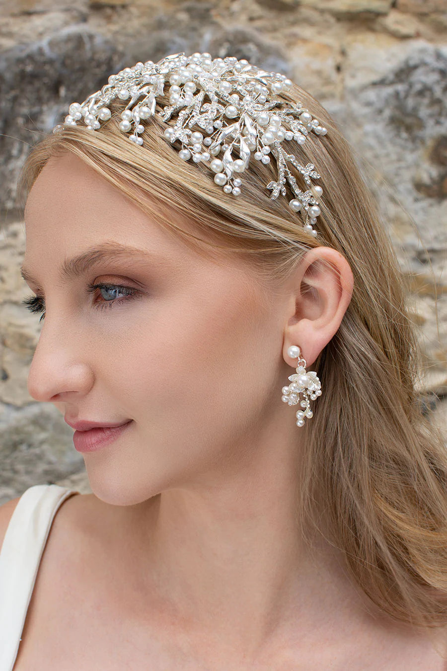 Silver pearl encrusted flower earrings in matte finish metal.