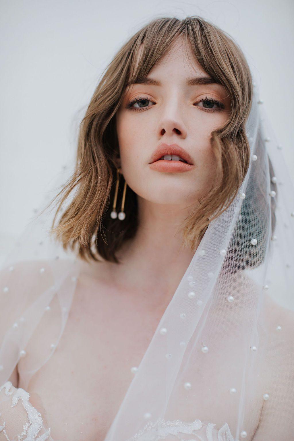 Close up of Oli Veil in silky tulle, dotted with pearl beads.