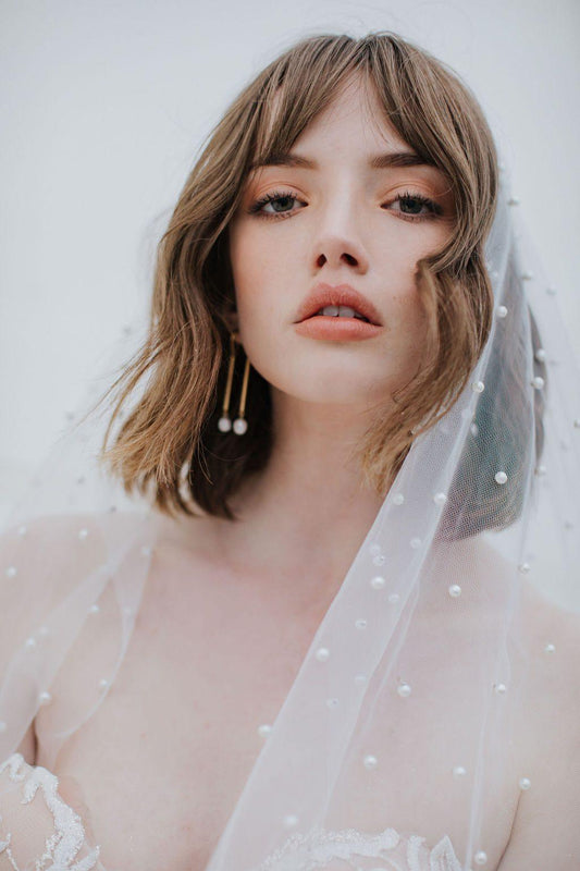 Close up of Oli Veil in silky tulle, dotted with pearl beads.