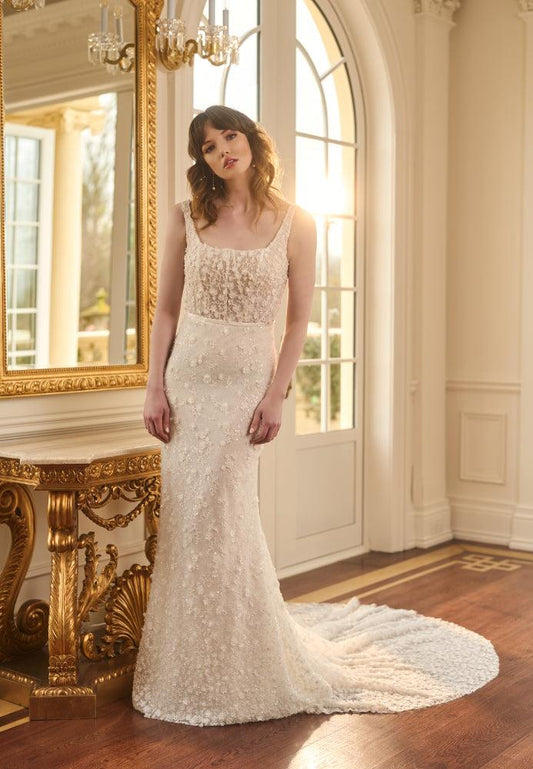 Ivory fit-n-flare wedding gown with delicate 3D florals and beads. Sheer boned corset with square neckline. 