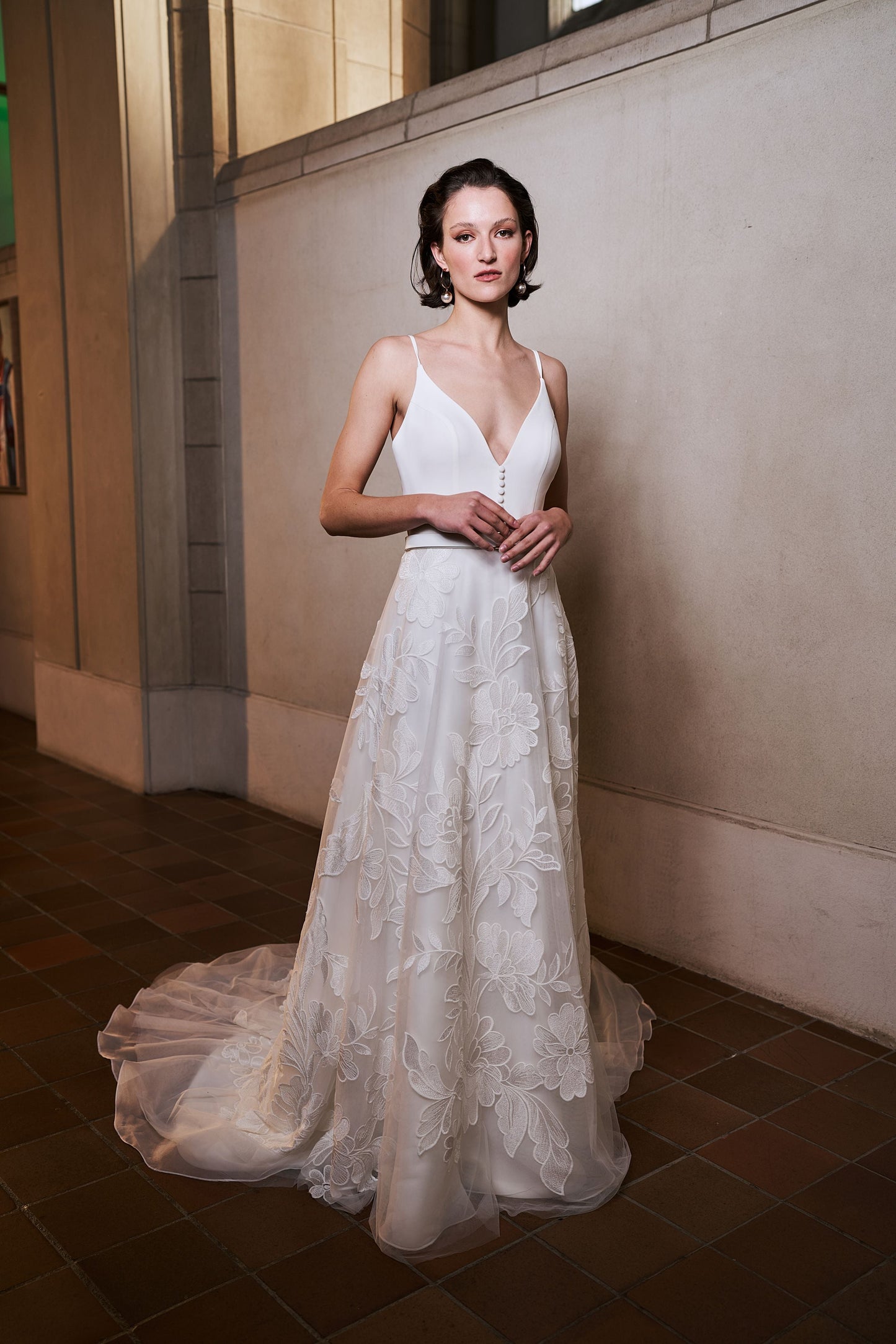 Model wearing Samara wedding dress with floral skirt from the Royal collection
