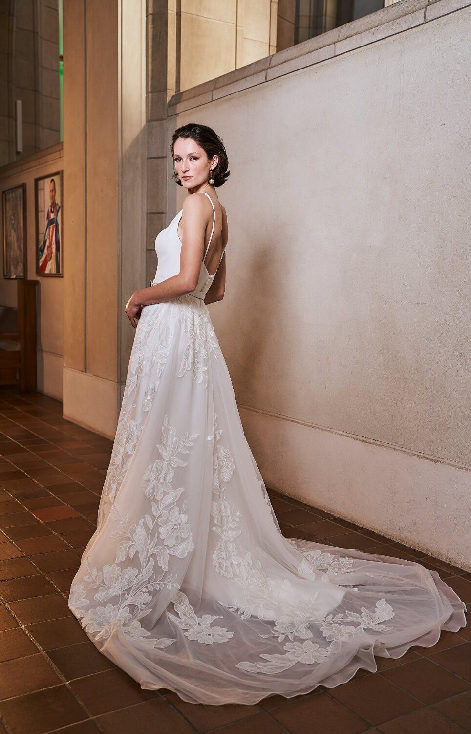 Model wearing Samara wedding dress with floral skirt from the Royal collection