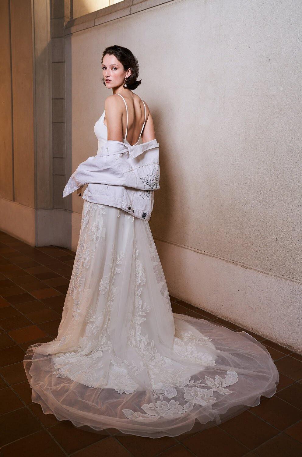 Model wearing Samara wedding dress with floral skirt from the Royal collection