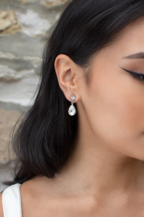 Rosemary earrings of round cubic zirconia stud with teardrop shaped diamante hanging from it.