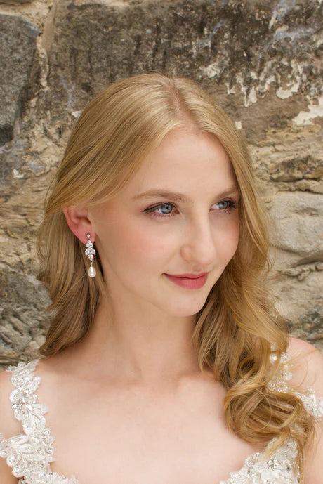 Remy Earrings in a drop of cubic zirconia with a teardrop pearl hanging from the bottom.