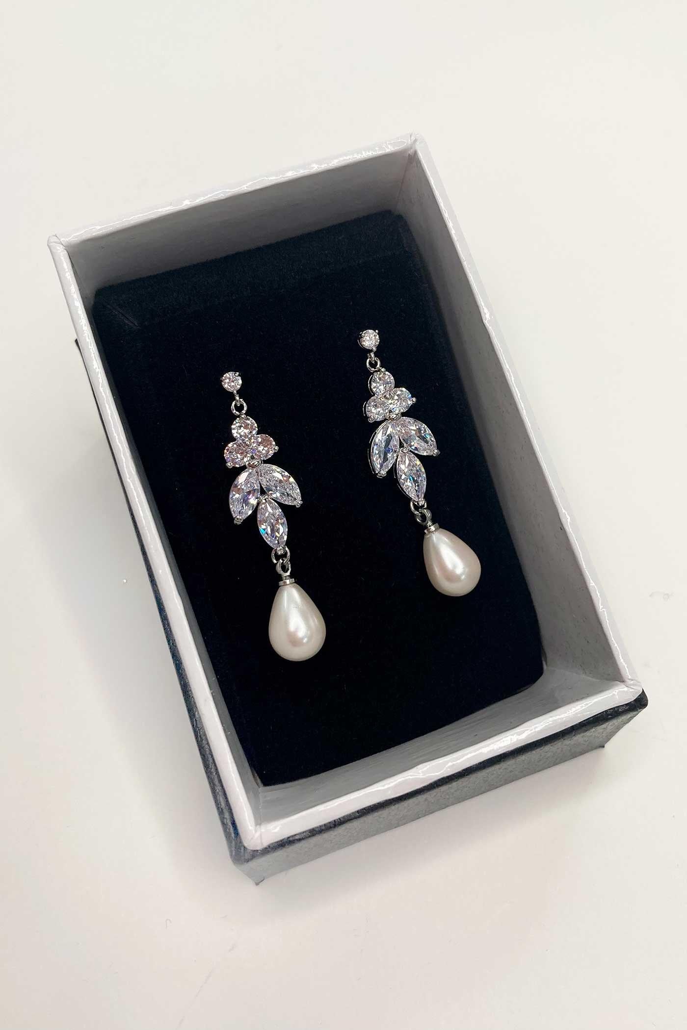 Remy Earrings in a drop of cubic zirconia with a teardrop pearl hanging from the bottom.