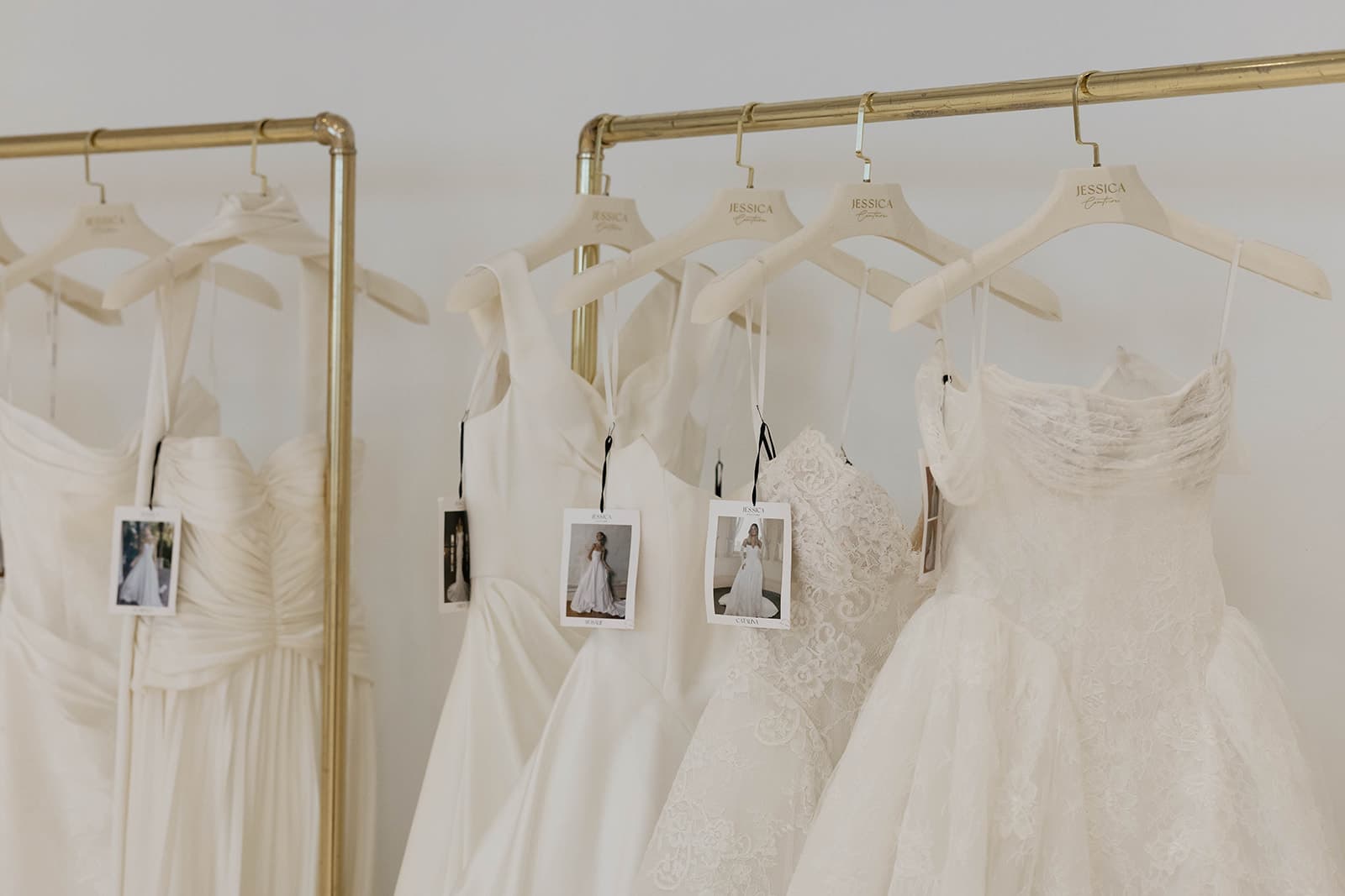 Jessica Couture wedding gowns on a rack in the boutique