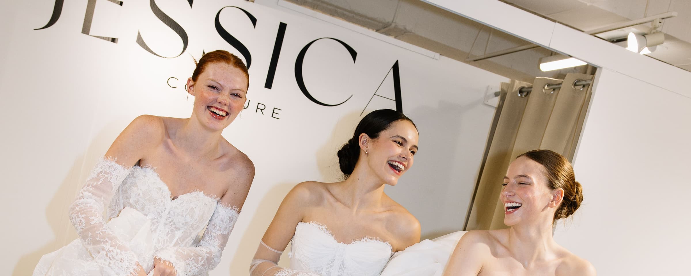 Brides celebrating together in Jessica Wu Couture Group gowns
